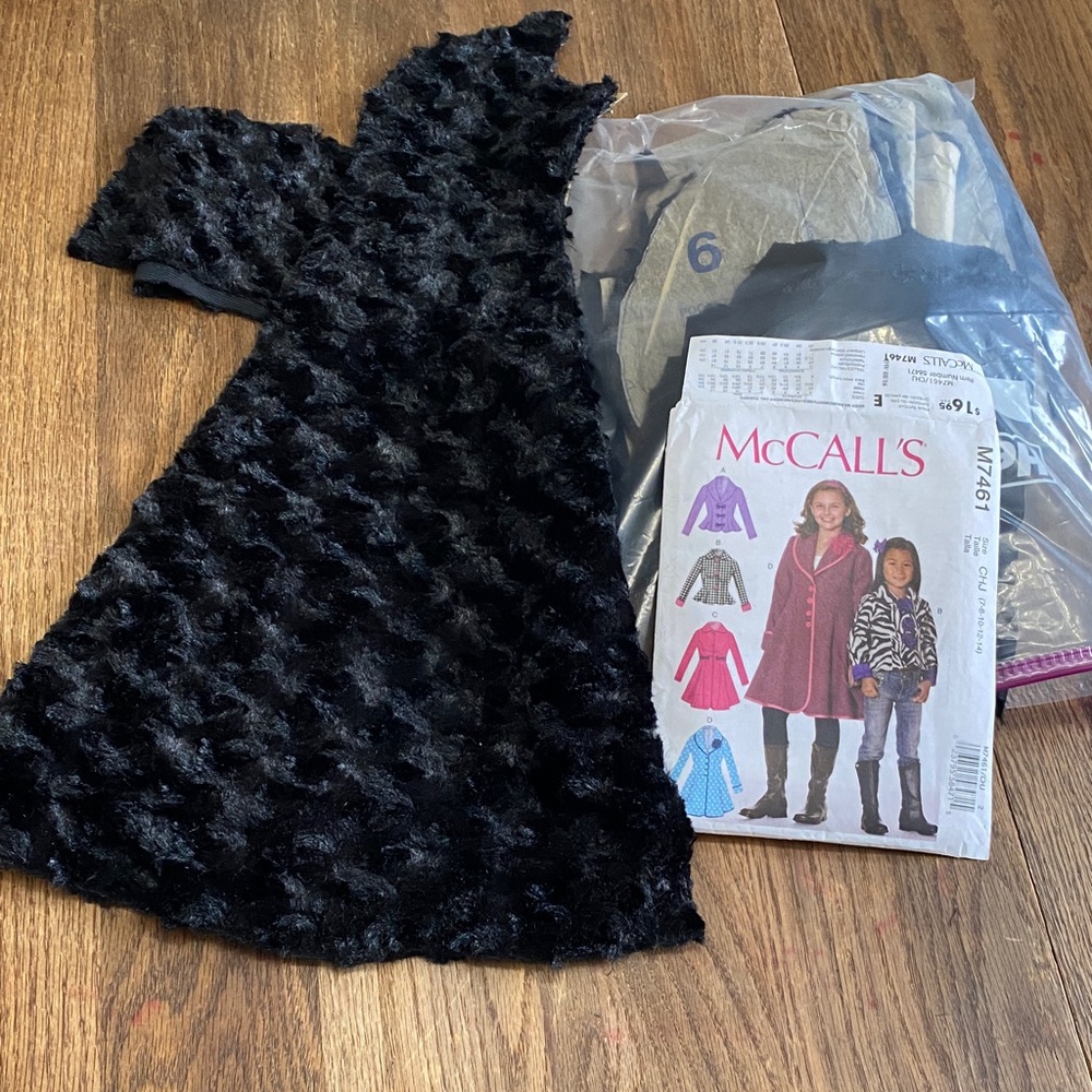 Black Textured Fabric with McCall's Pattern. Unfinished sewing project!